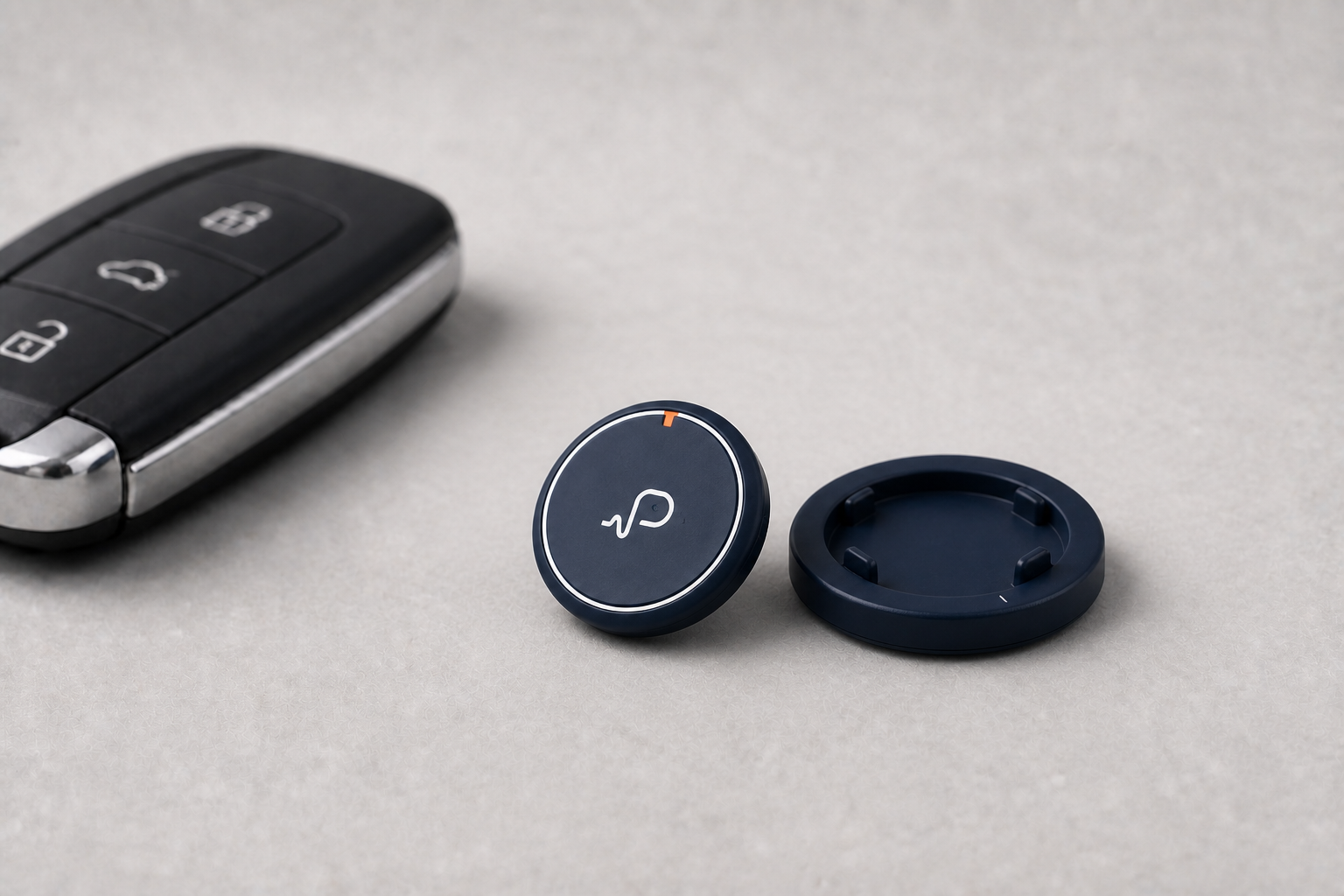 Compacte ronde Pressay Drive naast de DriveDock en een autosleutel